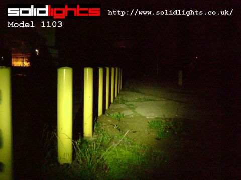 3 Watt 1103 shining on row of yellow poles